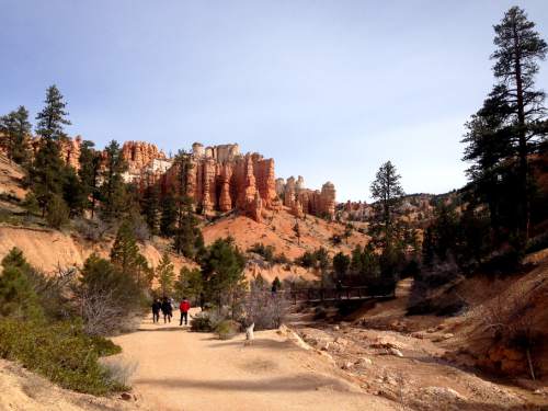 Erin Alberty  |  The Salt Lake Tribune

Hikers approach a bridge as hoodoos stand sentry over the trail to Mossy Cave on March 31, 2016 in Bryce Canyon National Park.