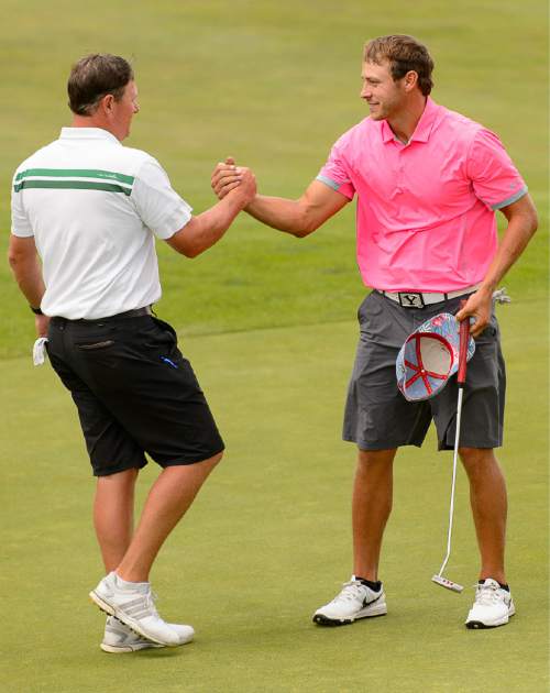 Trent Nelson  |  The Salt Lake Tribune
Darrin Overson, left, congratulates Jordan Rodgers, who just won the championship match of the 117th Utah State Amateur golf tournament at Soldier Hollow Golf Course in Midway, Saturday July 11, 2015.