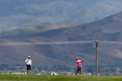 Trent Nelson  |  The Salt Lake Tribune
Darrin Overson, left, and Jordan Rodgers compete in the championship match of the 117th Utah State Amateur golf tournament at Soldier Hollow Golf Course in Midway, Saturday July 11, 2015.