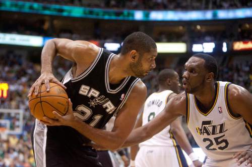 Jeremy Harmon  |  The Salt Lake Tribune

Tim Duncan is defended by Al Jefferson as the Jazz host the Spurs in the first round of the NBA playoffs at EnergySolutions Arena in Salt Lake City, Saturday, May 5, 2012.