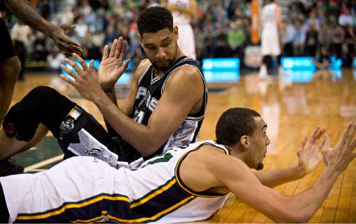 Lennie Mahler  |  The Salt Lake Tribune

Jazz center Rudy Gobert disputes a loose-ball foul call after he and Spurs forward Tim Duncan dived for the ball in the first half of a game at EnergySolutions Arena in Salt Lake City on Monday, Feb. 23, 2015.