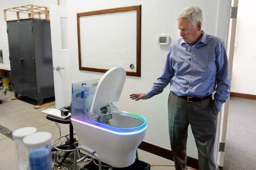 Trent Nelson  |  The Salt Lake Tribune
David Hall at his office in Provo, Tuesday June 14, 2016. Nearly 150 scientists and engineers are working for Hall intent on solving technical and social challenges for building a futuristic enclave modeled on Joseph Smith's Plat of the City of Zion. Research focuses on everything from low-impact toilets, new building materials and cooperative economic systems to methods for high-intensity food production. At left is a high tech toilet under development.