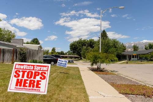 Trent Nelson  |  The Salt Lake Tribune
Signs in Provo's Pleasant View neighborhood, Tuesday June 14, 2016. A rally is scheduled for Thursday to oppose the plans of David Hall, who has already purchased 20 homes in the residential area and says he eventually hopes to buy them all, rezone and some day build his social experiment.