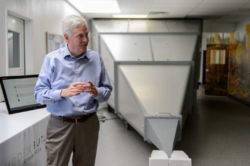 Trent Nelson  |  The Salt Lake Tribune
David Hall at his office in Provo, Tuesday June 14, 2016. Nearly 150 scientists and engineers are working for Hall intent on solving technical and social challenges for building a futuristic enclave modeled on Joseph Smith's Plat of the City of Zion. Research focuses on everything from low-impact toilets, new building materials and cooperative economic systems to methods for high-intensity food production. At right is an enclosure for limiting radio interference.