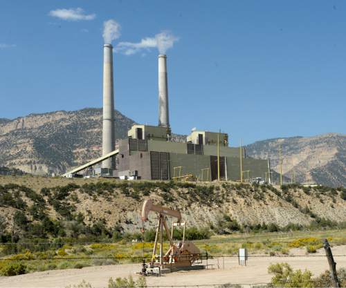 Al Hartmann  |  The Salt Lake Tribune
PacifiCorp's Huntington coal-fired power plant could be producing more power -- and emitting slightly more carbon -- if the utility is an early joiner of a proposed regional electric grid. But by 2030, according to a study of the grid's benefit, overall carbon emissions across the western U.S. would drop by as much as 3.5 percent as more states take advantage of renewable energy.