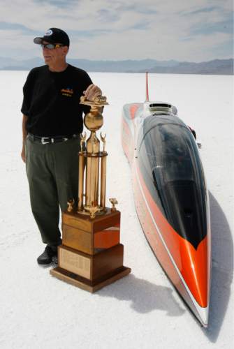 Rick Egan   |  Tribune file photo

George Poteet stands by his car "Speed Demon," along with the Hot Rod Magazine trophy, at the Bonneville Salt Flats, Thursday, August 18, 2011. The Speed Demon's top speed was 427 mph.