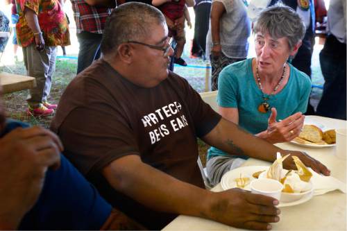Scott Sommerdorf   |  The Salt Lake Tribune  
U.S. Interior Secretary Sally Jewell speaks with Malcolm Lehi who wears a "Protect Bears Ears" t-shirt after a long meeting under a tent in a meadow atop the Bears Ears, Friday, July 15, 2016. The event included native dances and songs along with speeches from native people about how they are spiritually and culturally connected to the Bears Ears region.