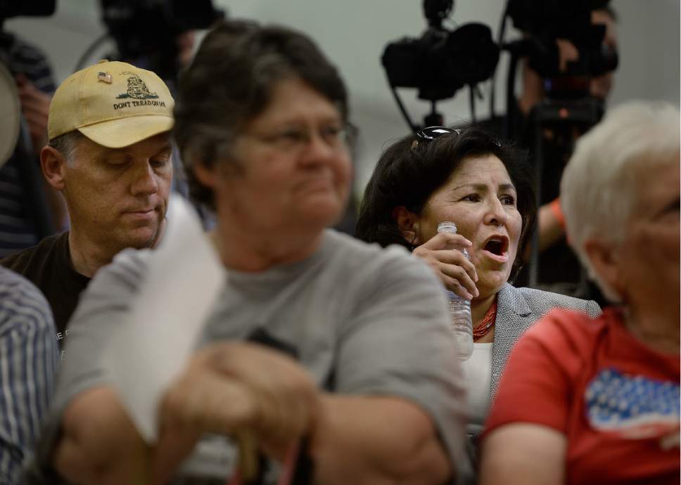 Scott Sommerdorf   |  The Salt Lake Tribune  
San Juan County Council member Rebecca Benally yells "boo" as a supporter of the Bears Ears National Monument finished speaking during the public meeting at the Bluff Community Center, Saturday, July 16, 2016. San Juan County Councilman Phil Lyman is at left.