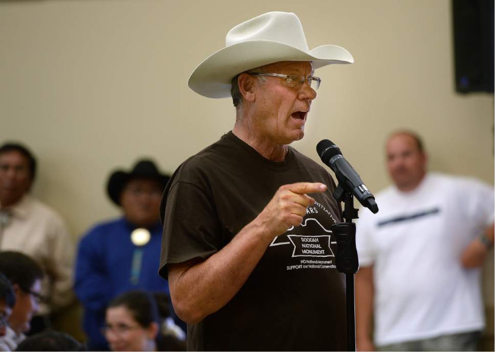Scott Sommerdorf   |  The Salt Lake Tribune  
San Juan County Councilman Bruce Adams got jeers from the native people after he announced that "my ancestors first settled this place" as he spoke during the public meeting at the Bluff Community Center, Saturday, July 16, 2016.