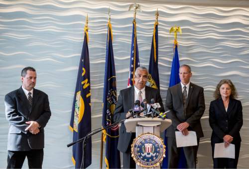 Trent Nelson  |  The Salt Lake Tribune
The arrest of former Utah Attorneys General Mark Shurtleff and John Swallow is announced at an press conference at FBI headquarters in Salt Lake City, Tuesday July 15, 2014. Left to right are Davis County Attorney Troy Rawlings, Salt Lake County District Attorney Sim Gill, Public Safety Commissioner Keith Squires, Mary Rook, special agent in charge of the FBI office in Salt Lake City.