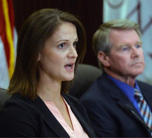 Al Hartmann  |  The Salt Lake Tribune 
Angela Dunn, MD, Deputy State Epidmiologist, speaks at press conference in Salt Lake City Monday July 18 on an on-going investigation of a unique Zika virus case in Utah.  Gary Edwards, Executive Diretctor, Salt Lake County Health Dept, right. The new case is a family contact who helped care for the individual who died from unknown causes who had beem infected with Zika after traveling to an area with the virus.