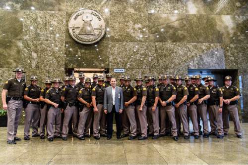 Trent Nelson  |  The Salt Lake Tribune
Utah Gov. Gary Herbert poses with Utah Highway Patrol troopers working crowd control at the 2016 Republican National Convention, at the Federal Building in Cleveland, Tuesday July 19, 2016.