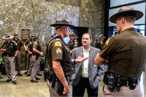 Trent Nelson  |  The Salt Lake Tribune
Utah Gov. Gary Herbert meets with Utah Highway Patrol troopers working crowd control at the 2016 Republican National Convention, at the Federal Building in Cleveland, Tuesday July 19, 2016.