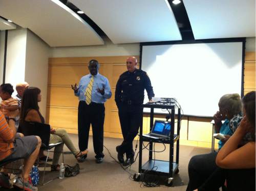 Courtney Tanner  | The Salt Lake Tribune

Salt Lake City Police Chief Mike Brown and community advisory board member David Parker spoke at an event geared toward addressing the concerns parents have for their children of color on July 19, 2016.
