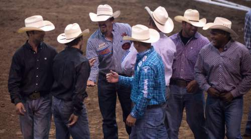 Steve Griffin / The Salt Lake Tribune

Cowboys congratulate Rowdy Parrott, of Mamou, LA, after he finished first in the steer wrestling event on opening night of the Days of '47 Rodeo at Vivint Smart Home Arena in Salt Lake City Tuesday July 19, 2016.
