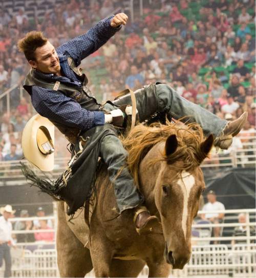 Rick Egan  |  The Salt Lake Tribune

Ethan Crouch, College Station, TX,  competes in the Bareback Riding competition, at the Days of 47 Rodeo, at Vivant Smart Home Arena, Wednesday, July 20, 2016.