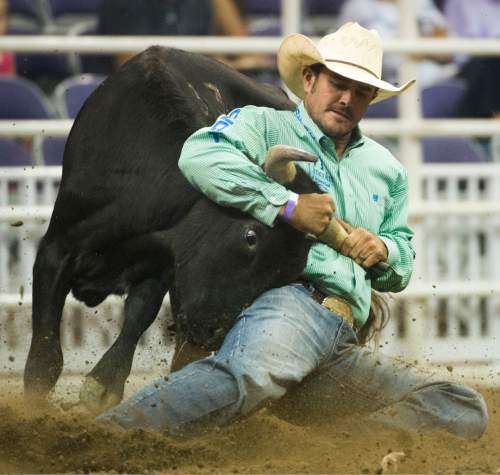 Rick Egan  |  The Salt Lake Tribune

Baylor Roche, Tremonton, scored a 4.95 in the Steer Wrestling, at the Days of 47 Rodeo, at Vivant Smart Home Arena, Wednesday, July 20, 2016.