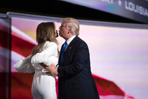 Republican presidential candidate Donald Trump, right, greets his wife Melania after introducing her during the Republican National Convention, Monday, July 18, 2016, in Cleveland. (AP Photo/Evan Vucci)