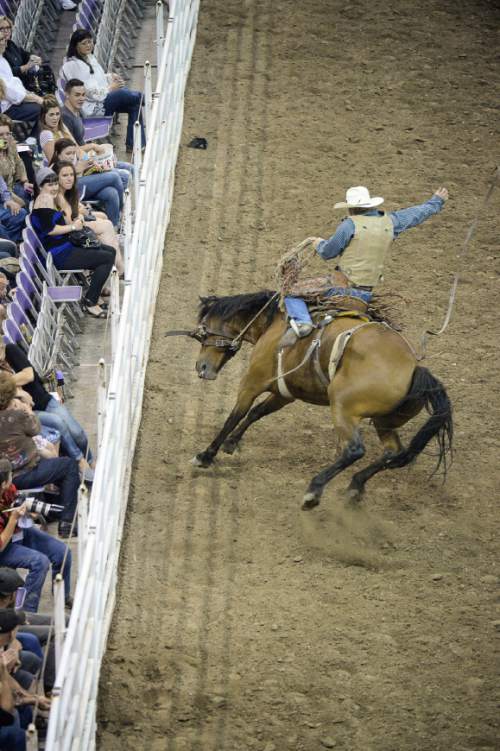 Francisco Kjolseth | The Salt Lake Tribune
Riders compete in the saddle bronc riding competition on day three to the Days of '47 Rodeo, at Vivint Arena, Thursday, July 21, 2016.