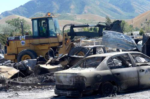 Al Hartmann  |  The Salt Lake Tribune 
Officials suspect arson destroyed 10 homes and other property in a neighborhood in Tooele, Utah, on Wednesday, July 20, 2016.