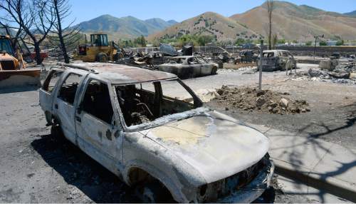 Al Hartmann  |  The Salt Lake Tribune 
Officials suspect arson destroyed 10 homes and other property in a neighborhood in Tooele, Utah, on Wednesday, July 20, 2016.