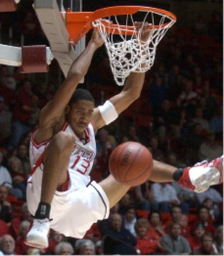 Rick Egan  |  The Salt Lake Tribune

Richard Chaney hangs on the rim after a big slam dunk near the end of the game extending the Utes lead over Georgia State at the Huntsman Center Monday November 17, 2003.
