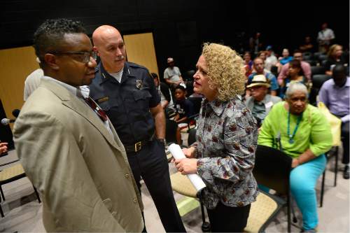 Scott Sommerdorf   |  The Salt Lake Tribune  
SLC Police Chief Mike Brown, center, and Salt Lake City Mayor Jackie Biskupski, right, speak with Wazir Jefferson, a student success advocate from the University of Utah during a break in a public engagement workshop called "Transforming Together," at the Sorenson Unity Center, Thursday, July 21, 2016.