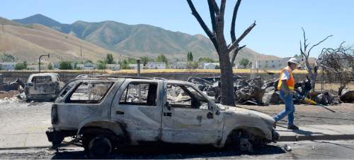 Al Hartmann  |  The Salt Lake Tribune 
Officials suspect arson destroyed 10 homes and other property in a neighborhood in Tooele, Utah, on Wednesday, July 20, 2016.