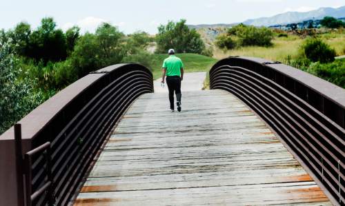Rick Egan  |  The Salt Lake Tribune

Brian Richey walks across the bridge ahead of the group, sitting 10-under oar after 12 holes, in the second round of the Utah Championship at Thanksgiving Point, Friday, July 22, 2016.