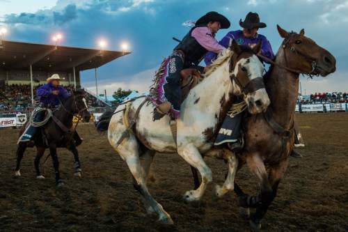 Chris Detrick  |  The Salt Lake Tribune
Stetson Wright, of Milford, Utah, gets off of the horse after competing in saddle bronc during the National High School Finals Rodeo evening performance at Wrangler Arena Friday July 22, 2016.