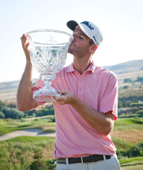 Michael Mangum  |  Special to the Tribune

Nicholas Lindheim kisses the Utah Championship trophy after winning the Web.com Tour's tournament at Thanksgiving Point in Lehi, Utah on Sunday, July 24th, 2016. Lindheim won with a final score of -15.