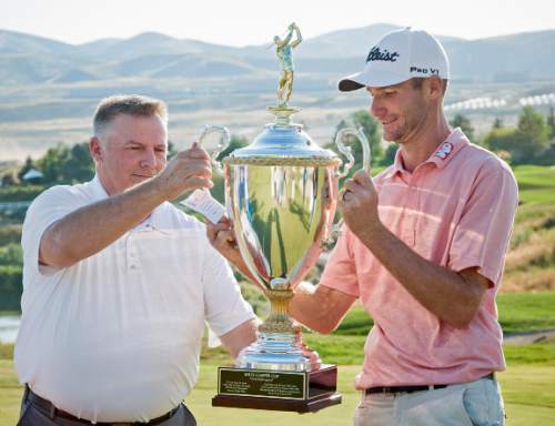 Michael Mangum  |  Special to the Tribune

Tournament winner Nicholas Lindheim accepts the Billy Casper Cup trophy from Bobby Casper during the Web.com Tour's Utah Championship tournament at Thanksgiving Point in Lehi, Utah on Sunday, July 24th, 2016. Lindheim won the event with a final score of -15.