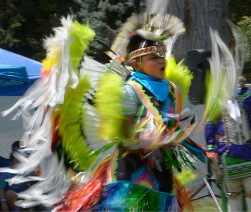 Al Hartmann  |  The Salt Lake Tribune 
Junior Boys fancy dancer twirls at the annual Native American Celebration at Liberty Park July 25.
