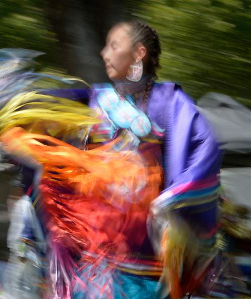 Al Hartmann  |  The Salt Lake Tribune 
Junior Girl's fancy dancer twirls at the annual Native American Celebration at Liberty Park July 25.