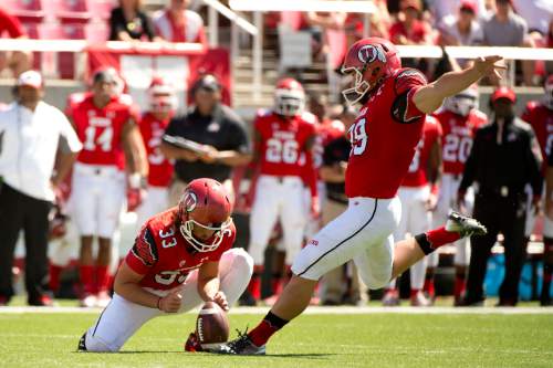 Jeremy Harmon  |  The Salt Lake Tribune

Utah's Andy Phillips (39) scores Utah's first points of the game as the Utes host the Bulldogs at Rice-Eccles Stadium on Saturday, Sept. 6, 2014. Tom Hackett (33) is holding the ball.
