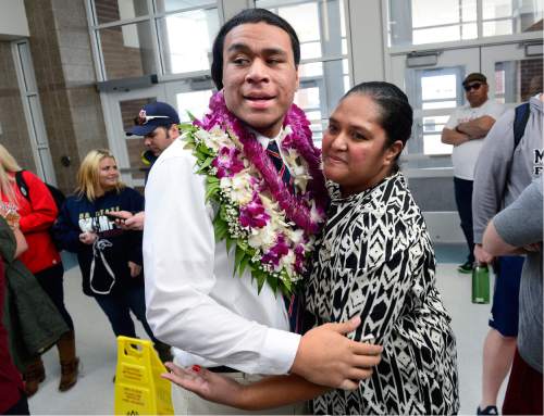 Scott Sommerdorf   |  The Salt Lake Tribune
Herriman defensive end Leki Fotu hugs his aunt Uini Eli after she presented him with a flowered lei prior to the ceremony in which he announced that he's committed to play football at the University of Utah, Wednesday, February 3, 2016.