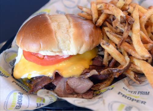 Al Hartmann  |  The Salt Lake Tribune 
A popular Special of the Day, soon to be to the menu, is the Pork City U.S.A Burger. It's made with fried egg, Proper sauce, tomato, jalepeno, American cheese and house-made ham bacon at Proper Burger Co. in Salt Lake City.