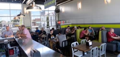 Al Hartmann  |  The Salt Lake Tribune 
You canít get Proper beers any fresher than here at Proper Burger and Proper Brewingís new location on Main Street in downtown Salt Lake City. Wash down burgers and killer fries with your brews on the patio or over a game of pool.