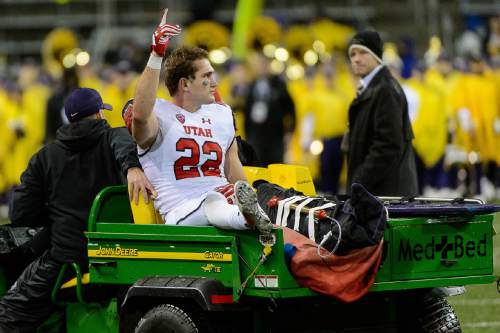 Trent Nelson  |  The Salt Lake Tribune
Utah's Chase Hansen (22) is taken from the field following the game as the University of Utah faces the University of Washington, NCAA football at Husky Stadium in Seattle, Saturday November 7, 2015.