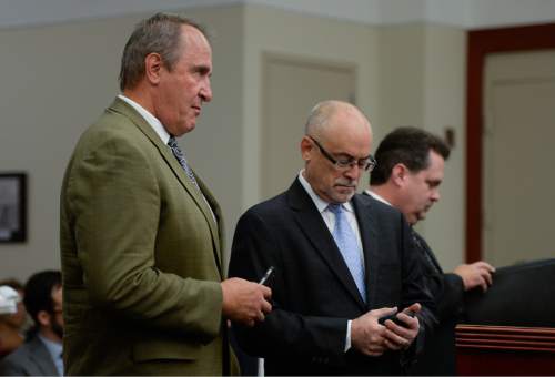 Francisco Kjolseth | The Salt Lake Tribune
Former Utah Attorney General Mark Shurtleff, left, facing public corruption charges, appears in Judge Elizabeth Hruby-Mills courtroom alongside his attorney Richard Van Wagoner, center, in Salt Lake City on Monday, Sept. 28, 2015, for a pre-trial hearing. At right is Davis County prosecutor Troy Rawlings.