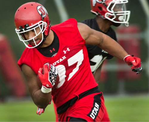 Steve Griffin  |  The Salt Lake Tribune


University of Utah tight end Siale Fakailoatonga tucks the ball and runs after catching a pass during second day of the teams fall camp at the University of Utah baseball field  in Salt Lake City, Friday, August 7, 2015.