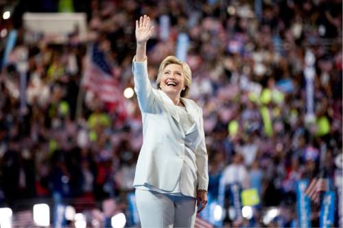 Democratic presidential candidate Hillary Clinton waves to the crowd as she takes the stage to speak during the fourth day session of the Democratic National Convention in Philadelphia , Thursday, July 28, 2016. (AP Photo/Andrew Harnik)