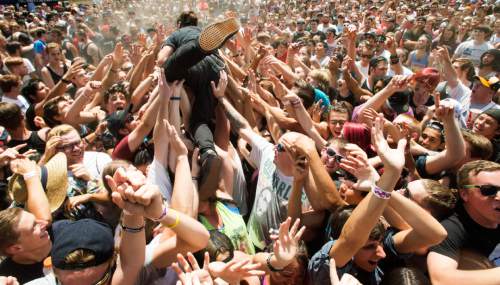 Rick Egan  |  The Salt Lake Tribune

Silverstein lead singer, Shane Told dives in to the crowd, at the Vans Warped Tour 2015, at the Utah State Fairgrounds, 
Saturday, August 1, 2015.