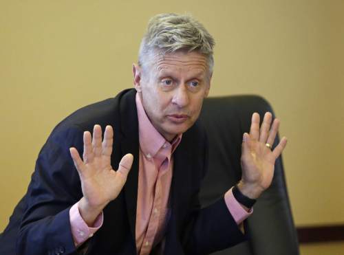 FILE - In this May 18, 2016 file photo, Libertarian presidential candidate, former New Mexico Gov. Gary Johnson speak with legislators at the Utah State Capitol in Salt Lake City. He has virtually no money, no strategy to compete in battleground states and no plan to stop talking about his drug use. Yet with the Republican Party facing the prospect of a Donald Trump presidency, Libertarian presidential hopeful Gary Johnson could be a factor in 2016. The former two-term New Mexico governor, a Republican businessman perhaps best known for his years-long push to legalize marijuana, has a sobering message for a "never-Trump" movement desperately seeking a viable alternative. (AP Photo/Rick Bowmer, File)