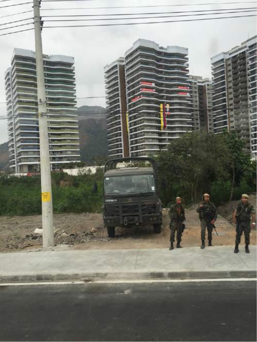 Christopher Kamrani | Salt Lake Tribune

Brazilian armed forces patrol the street just outside the Olympic Village on Wednesday morning.