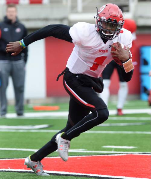 Steve Griffin  |  The Salt Lake Tribune


Utah freshman quarterback Tyler Huntley sprints away from the pass rush during spring football practice at Rice-Eccles Stadium in Salt Lake City, Tuesday, March 29, 2016. Huntley and Simpkins both attended Hallandale High School in Florida.