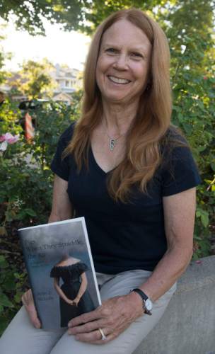 Steve Griffin / The Salt Lake Tribune

Utah writer Julie J. Nichols with her novel "Pigs When They Straddle the Air" in Salt Lake City Wednesday July 20, 2016.