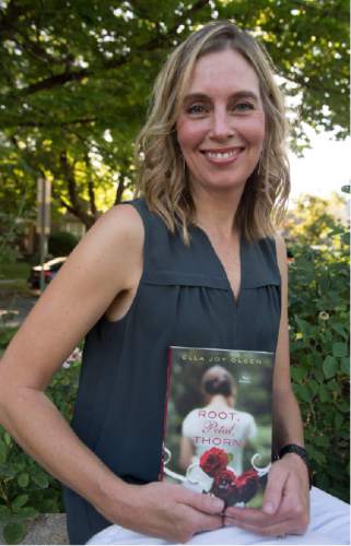 Steve Griffin / The Salt Lake Tribune

Utah writer Ella Joy Olsen, with her novel "Root, Petal, Thorn."  in Salt Lake City Wednesday July 20, 2016.
