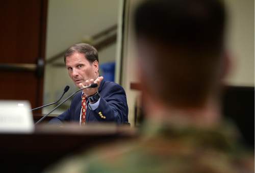 Scott Sommerdorf   |  The Salt Lake Tribune  
Utah Congressman Chris Stewart, gestures toward Major General Jefferson S. Burton, Adjutant General - Army, Utah National Guard as he greeted those in attendance prior to speaking to the Legislature's Veterans' and Military Affairs Commission about his ideas for reforming the VA, Wednesday, August 3, 2016.