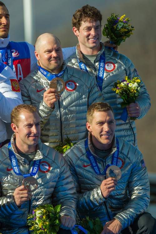 KRASNAYA POLYANA, RUSSIA  - JANUARY 23:
USA's Steven Holcomb, Chris Fogt, Curtis Tomasevicz, and Steve Langton, celebrate during the medal ceremony at the finish of the four-man bobsled at Sanki Sliding Center during the 2014 Sochi Olympics Sunday February 23, 2014. They won the bronze medal with a cumulative time of 3:40.99. 
(Photo by Chris Detrick/The Salt Lake Tribune)